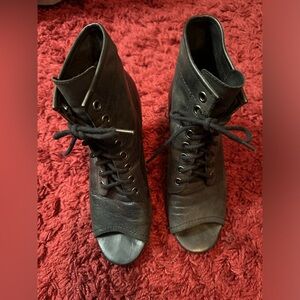 Vintage black peep toe; tie up all leather bootie in a size 7M